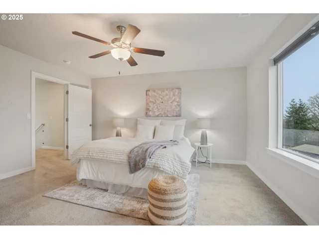 a bedroom with a bed and window