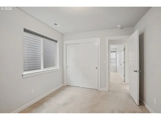 a big room with windows and closet