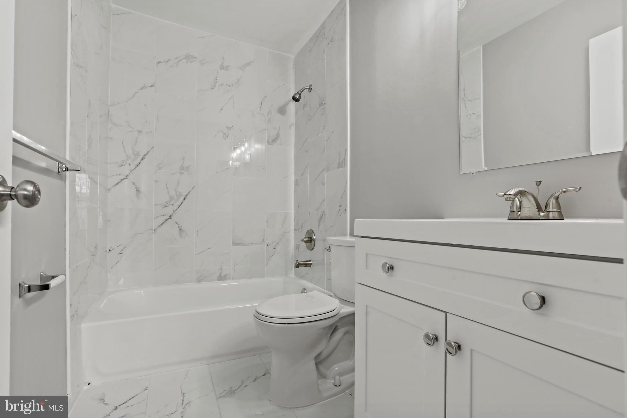 8617 Castlemill Circle Nottingham, MD 21236 - Photo 15 of 25 a bathroom with a sink a toilet and a bathtub