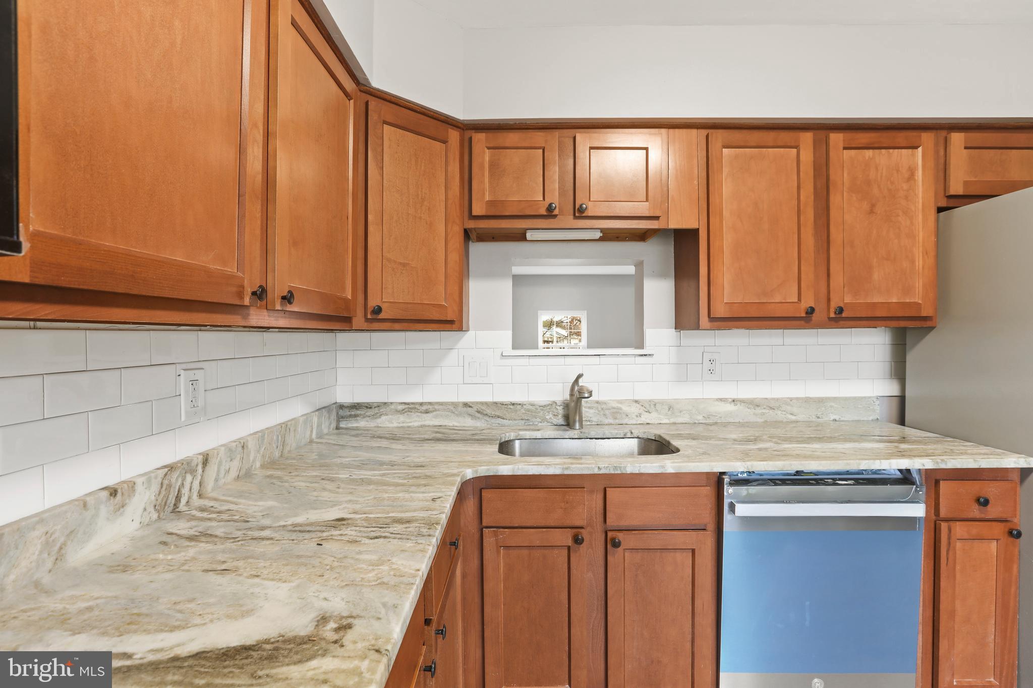 8617 Castlemill Circle Nottingham, MD 21236 - Photo 6 of 25 a kitchen with stainless steel appliances granite countertop a sink a stove and cabinets