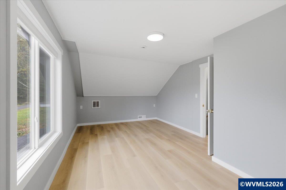 28411 Liberty Road Sweet Home, OR 97386 - Photo 41 of 50 a view of a big room with wooden floor and windows in a room