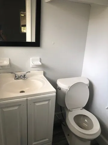 a view of a hallway with a wooden floor
