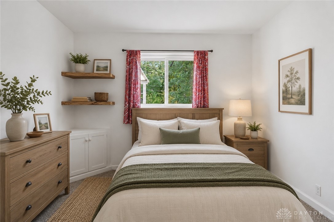 629 Storms Road Dayton, OH 45429 - Photo 5 of 51 This cozy bedroom offers a tranquil retreat with ample natural light.