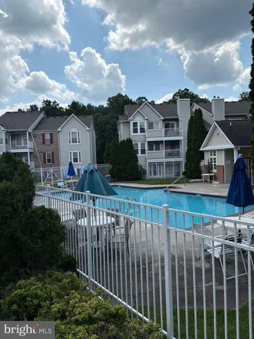 a front view of a house with a wooden fence