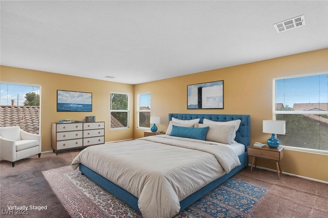 5033 Ropers Rock Court Las Vegas, NV 89131 - Photo 12 of 40 Carpeted bedroom featuring multiple windows