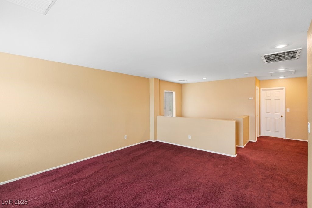 5033 Ropers Rock Court Las Vegas, NV 89131 - Photo 17 of 40 Carpeted empty room featuring baseboards and recessed lighting