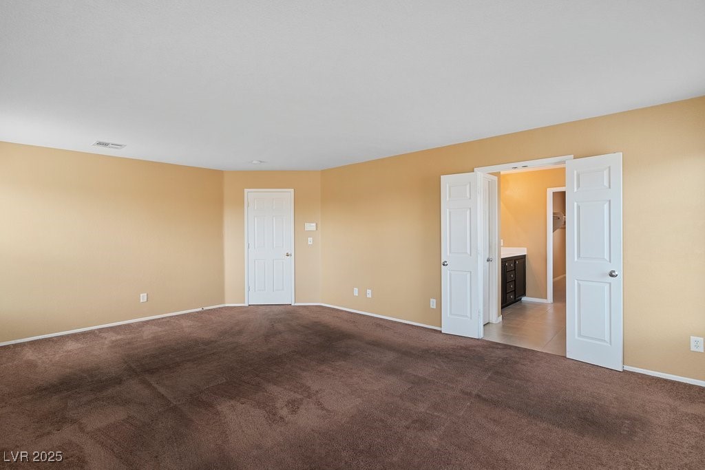 5033 Ropers Rock Court Las Vegas, NV 89131 - Photo 22 of 40 Spare room featuring carpet and baseboards