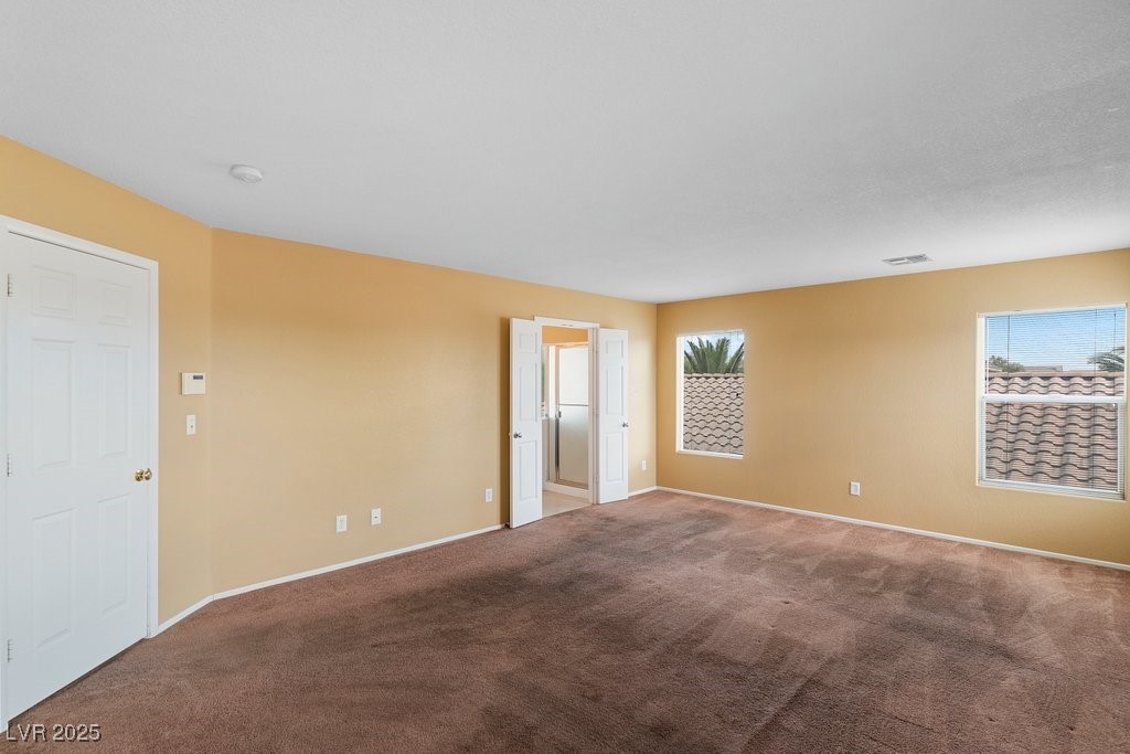 5033 Ropers Rock Court Las Vegas, NV 89131 - Photo 23 of 40 Carpeted spare room with baseboards