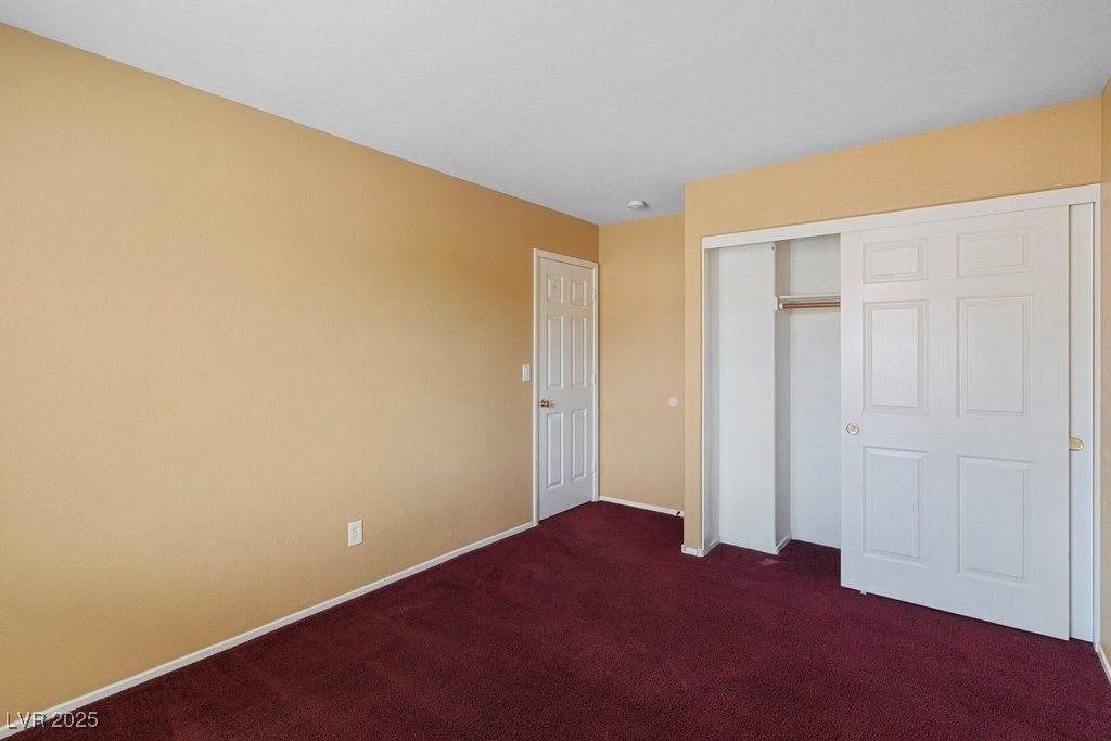 5033 Ropers Rock Court Las Vegas, NV 89131 - Photo 27 of 40 Unfurnished bedroom with carpet flooring and a closet