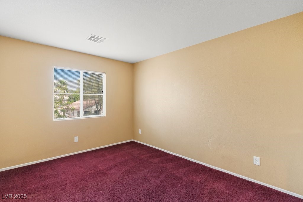 5033 Ropers Rock Court Las Vegas, NV 89131 - Photo 29 of 40 Empty room with carpet floors and baseboards