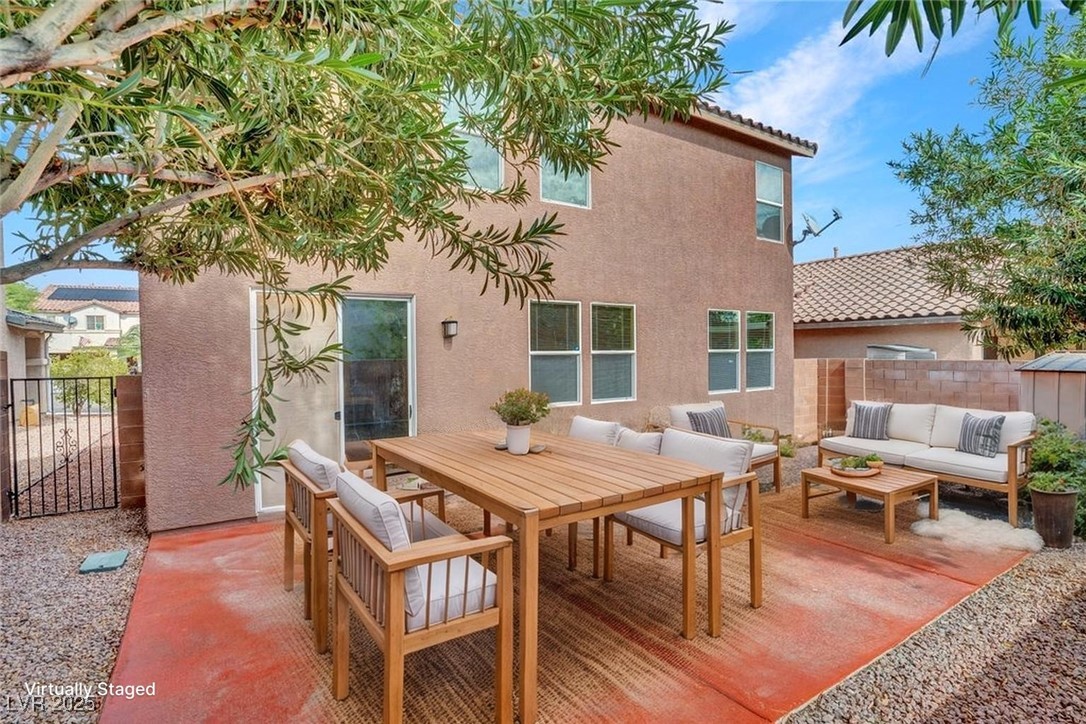 5033 Ropers Rock Court Las Vegas, NV 89131 - Photo 32 of 40 Rear view of house with a patio area, stucco siding, a tiled roof, outdoor dining area, and an outdoor hangout area