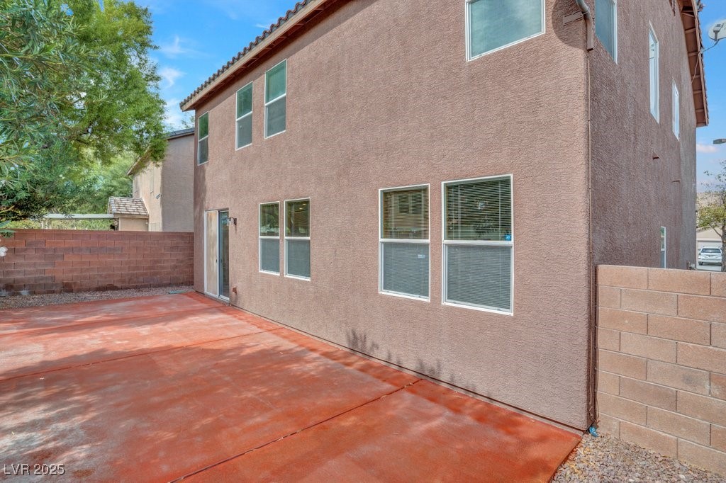 5033 Ropers Rock Court Las Vegas, NV 89131 - Photo 36 of 40 Back of property featuring a patio, stucco siding, and a tile roof