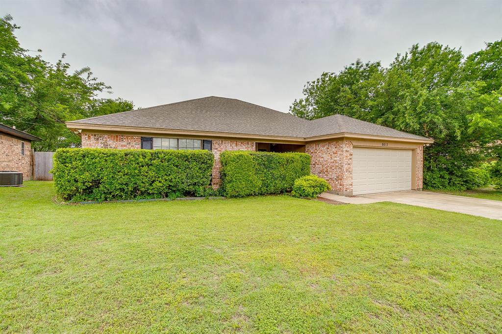 8613 Silver Creek Road White Settlement, TX 76108 - Photo 1 of 40 a front view of a house with garden