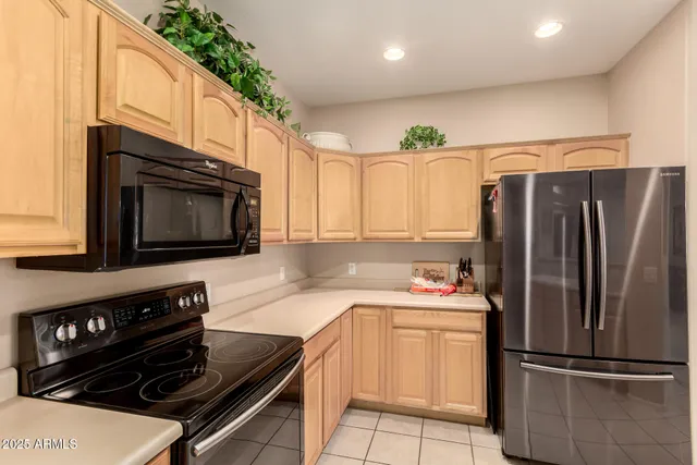 a kitchen with a refrigerator stove and microwave