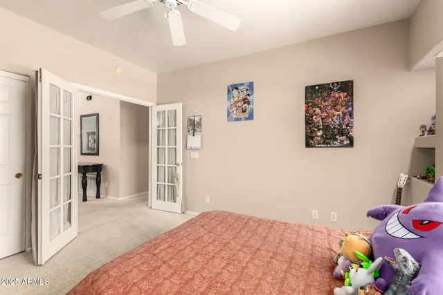 a bedroom with a bed and a window