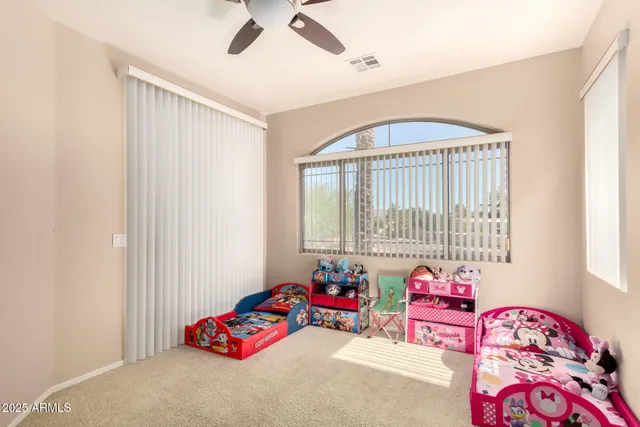a bedroom with bed and a window