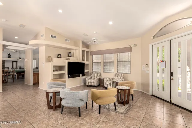 a living room with furniture and a large window