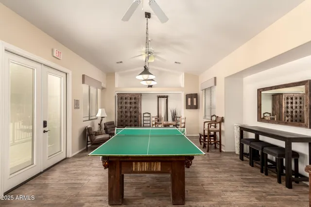 a room with furniture and pool table