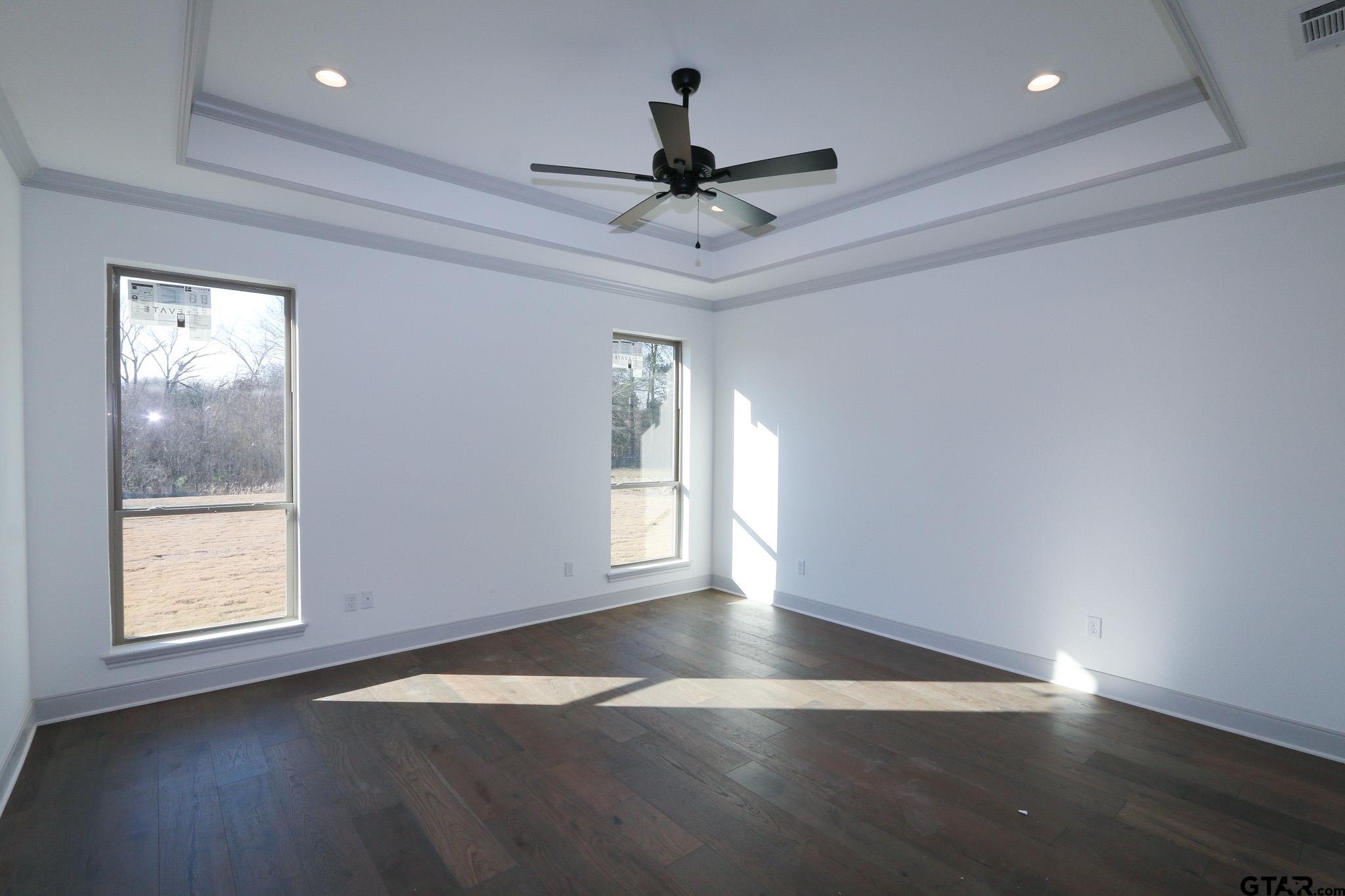 16527 Cooper Way Flint, TX 75762 - Photo 19 of 33 a view of an empty room with wooden floor and a window