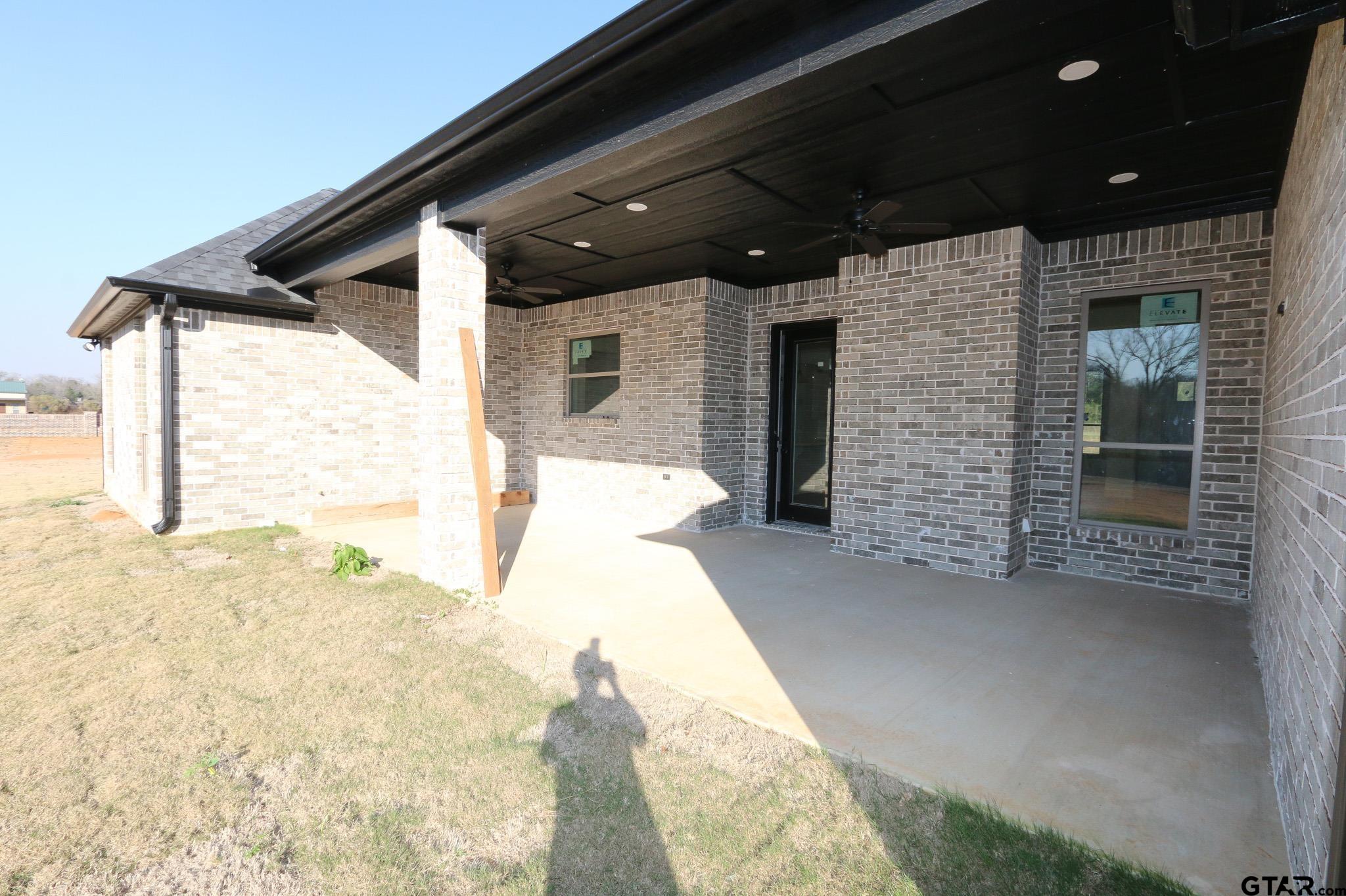 16527 Cooper Way Flint, TX 75762 - Photo 33 of 33 a view of a porch with a table and chairs