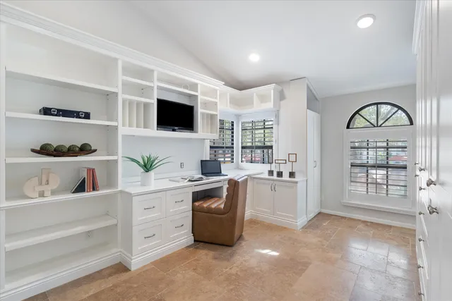 a kitchen with stainless steel appliances a stove a sink and a refrigerator