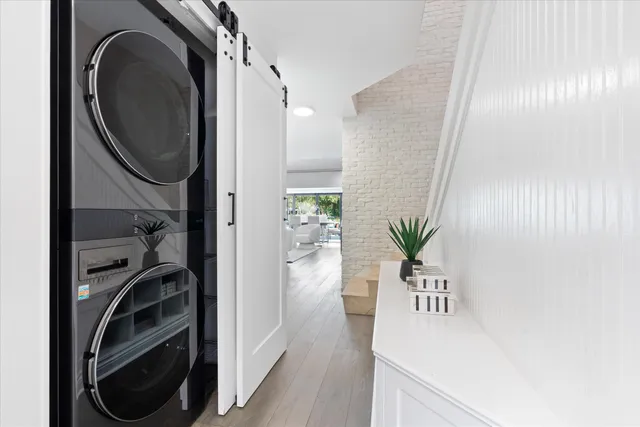 a view of a hallway with washer and dryer
