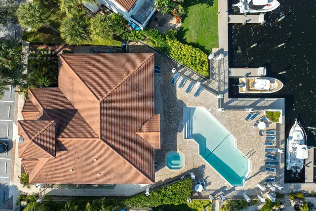 aerial view of a house with a yard