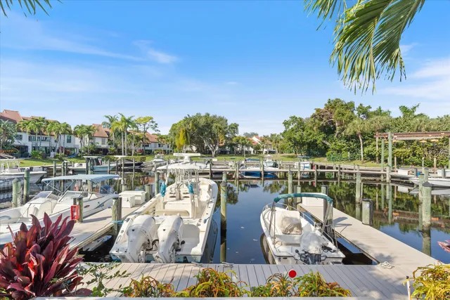 a view of a lake with couches chairs