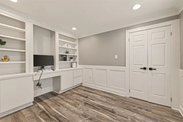 a room with white cabinets and white appliances