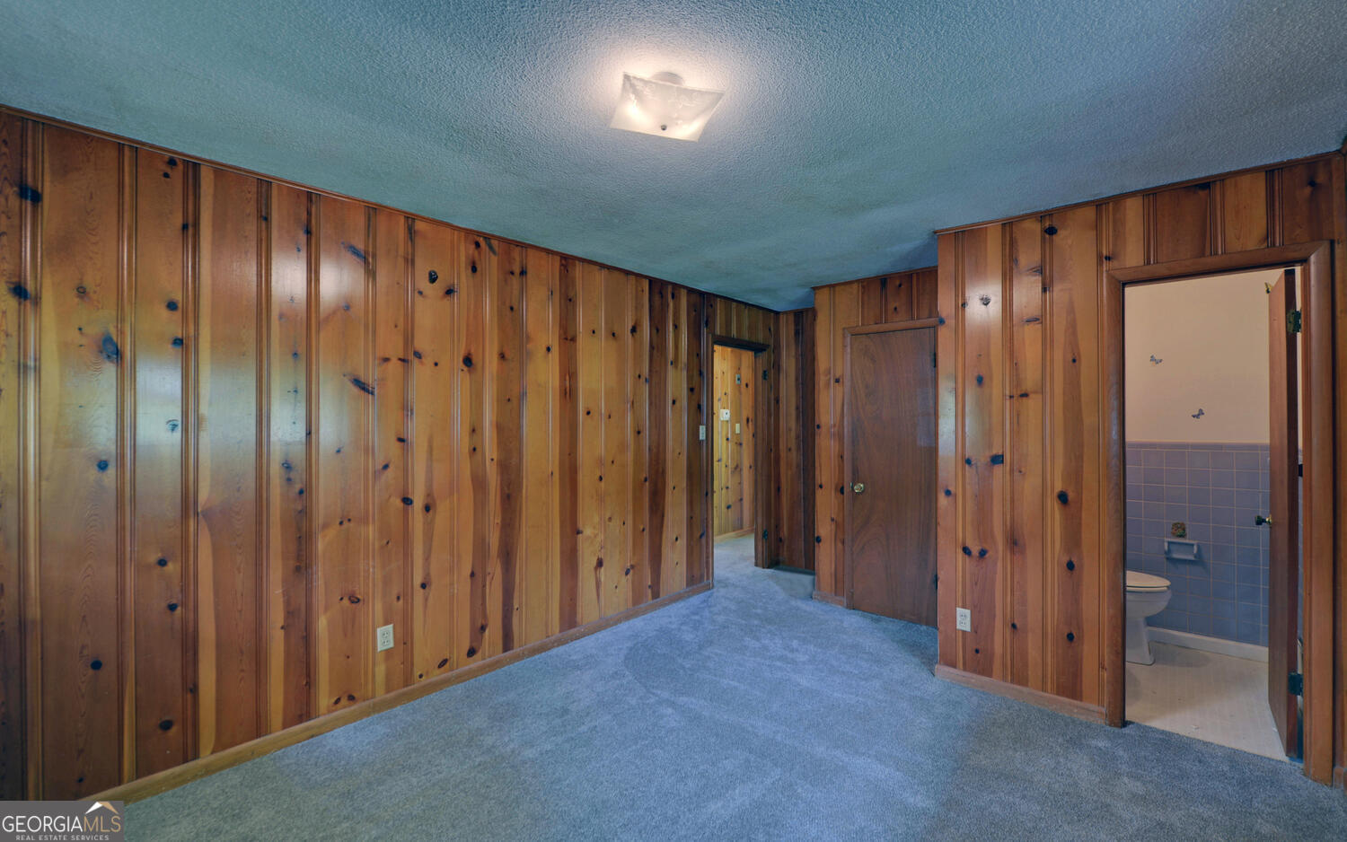 586 Collins Road Toccoa, GA 30577 - Photo 15 of 52 a view of a hallway with wooden shelves
