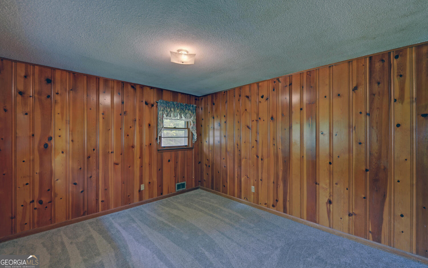 586 Collins Road Toccoa, GA 30577 - Photo 16 of 52 a view of a hallway with wooden walls
