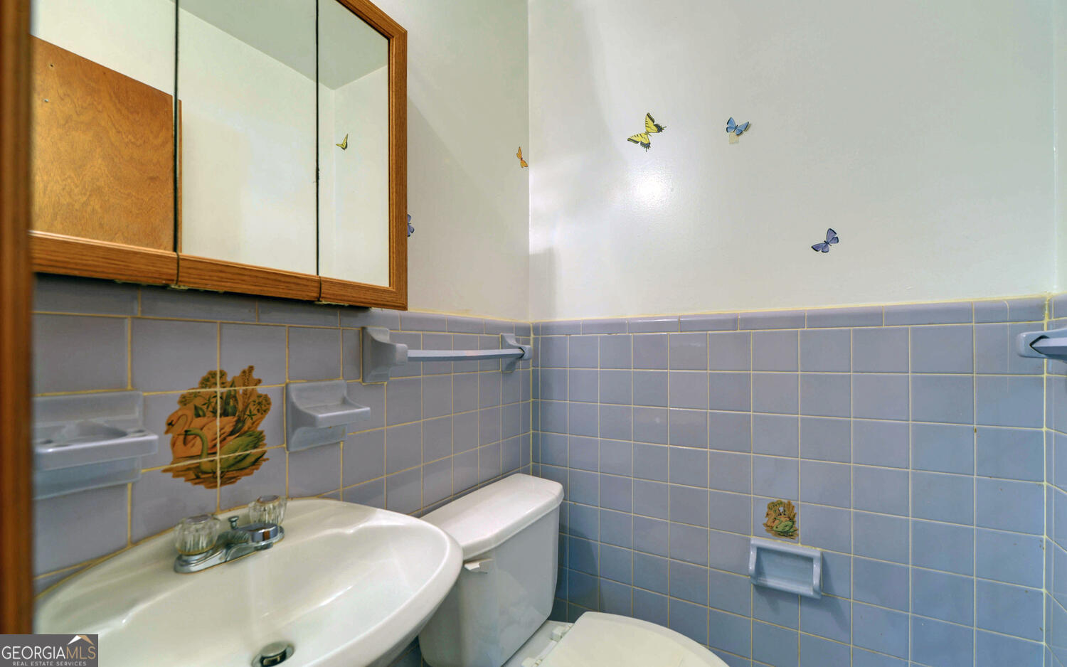 586 Collins Road Toccoa, GA 30577 - Photo 18 of 52 a bathroom with a sink a toilet and a mirror