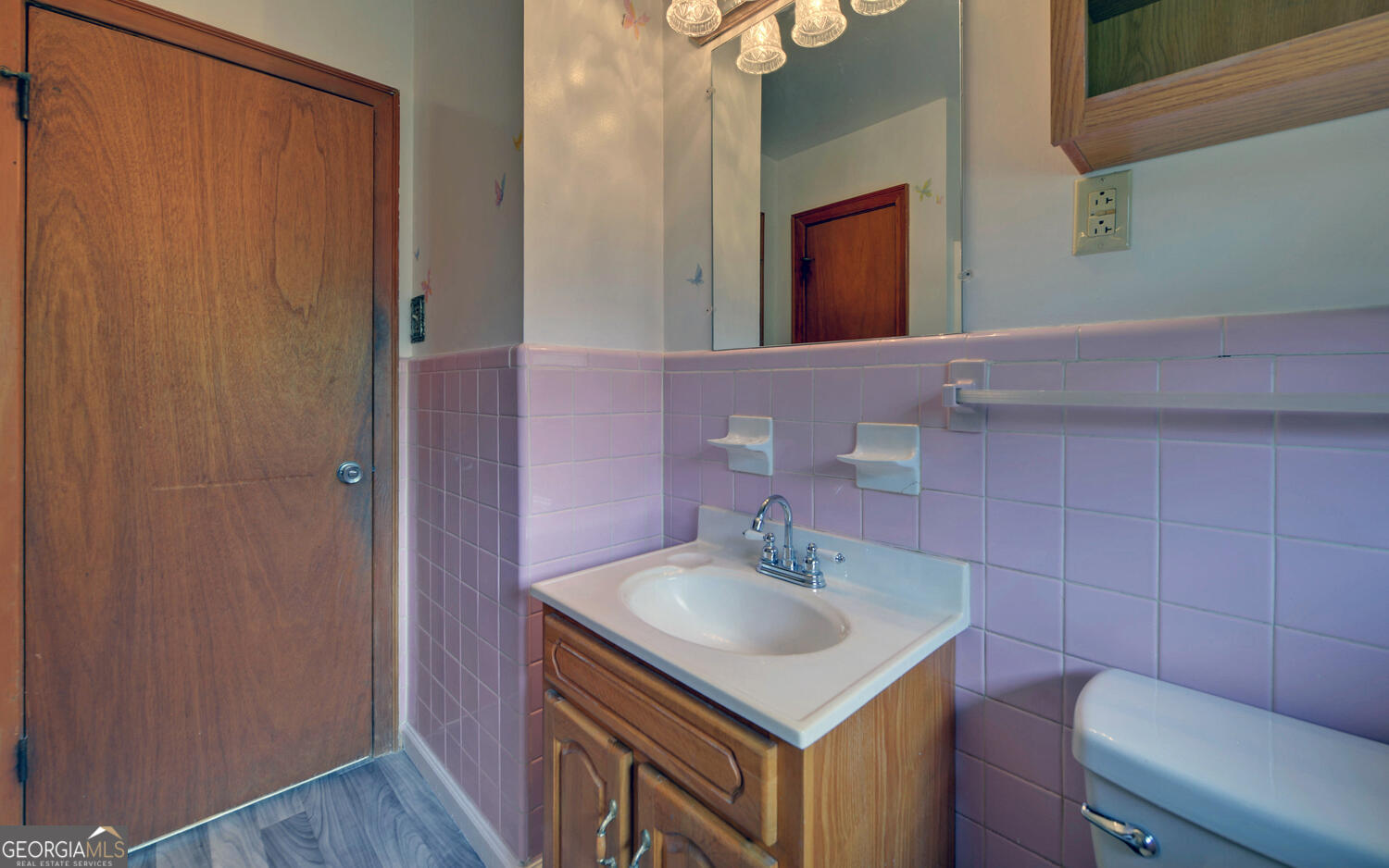586 Collins Road Toccoa, GA 30577 - Photo 22 of 52 a bathroom with a sink a toilet and mirror