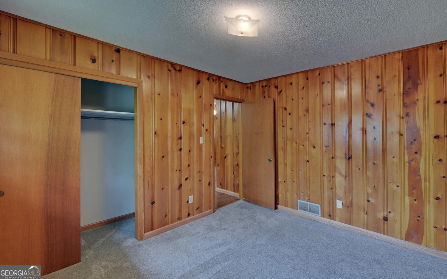 586 Collins Road Toccoa, GA 30577 - Photo 26 of 52 a view of a hallway with wooden walls