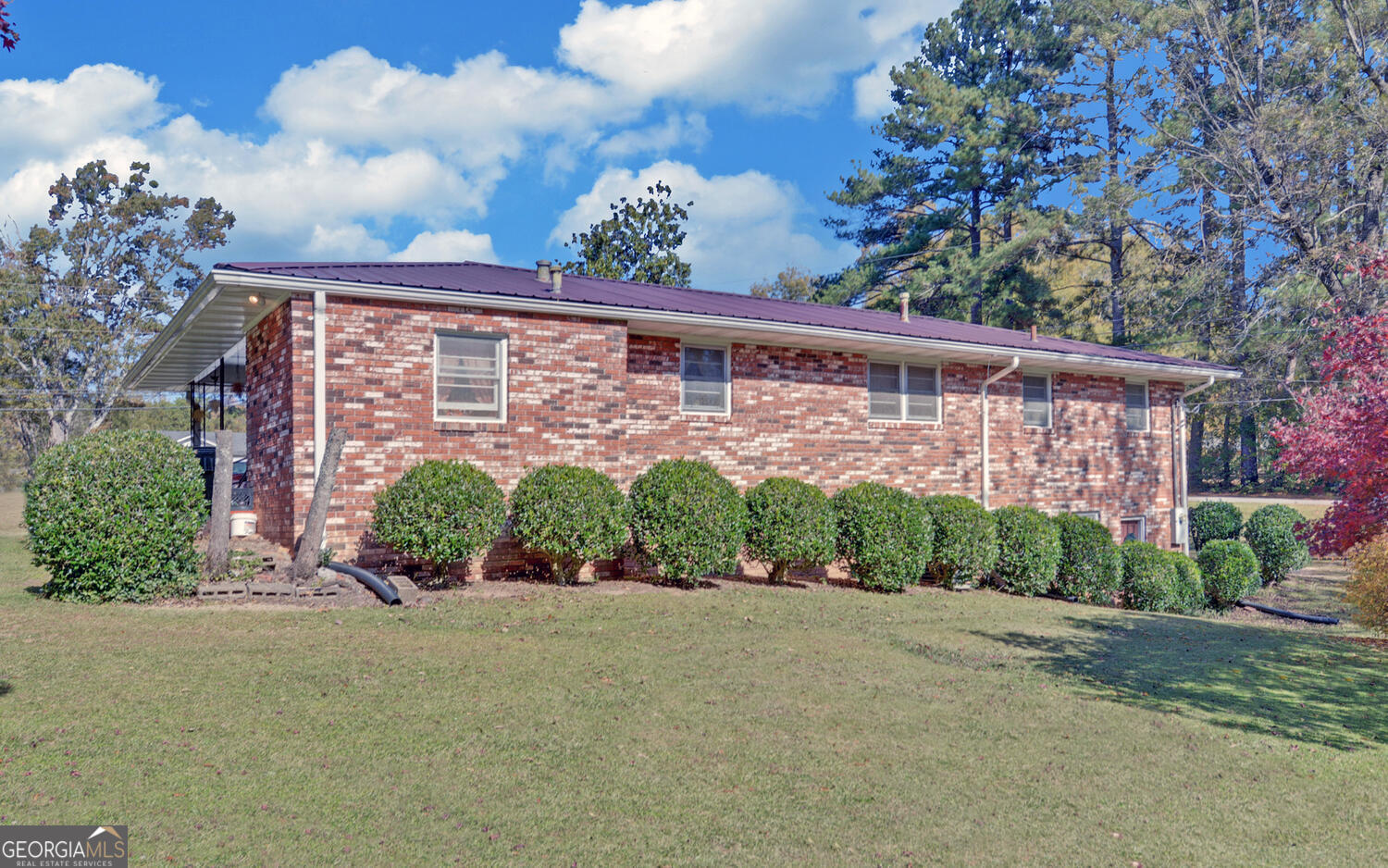 586 Collins Road Toccoa, GA 30577 - Photo 34 of 52 a front view of a house with a yard and outdoor seating