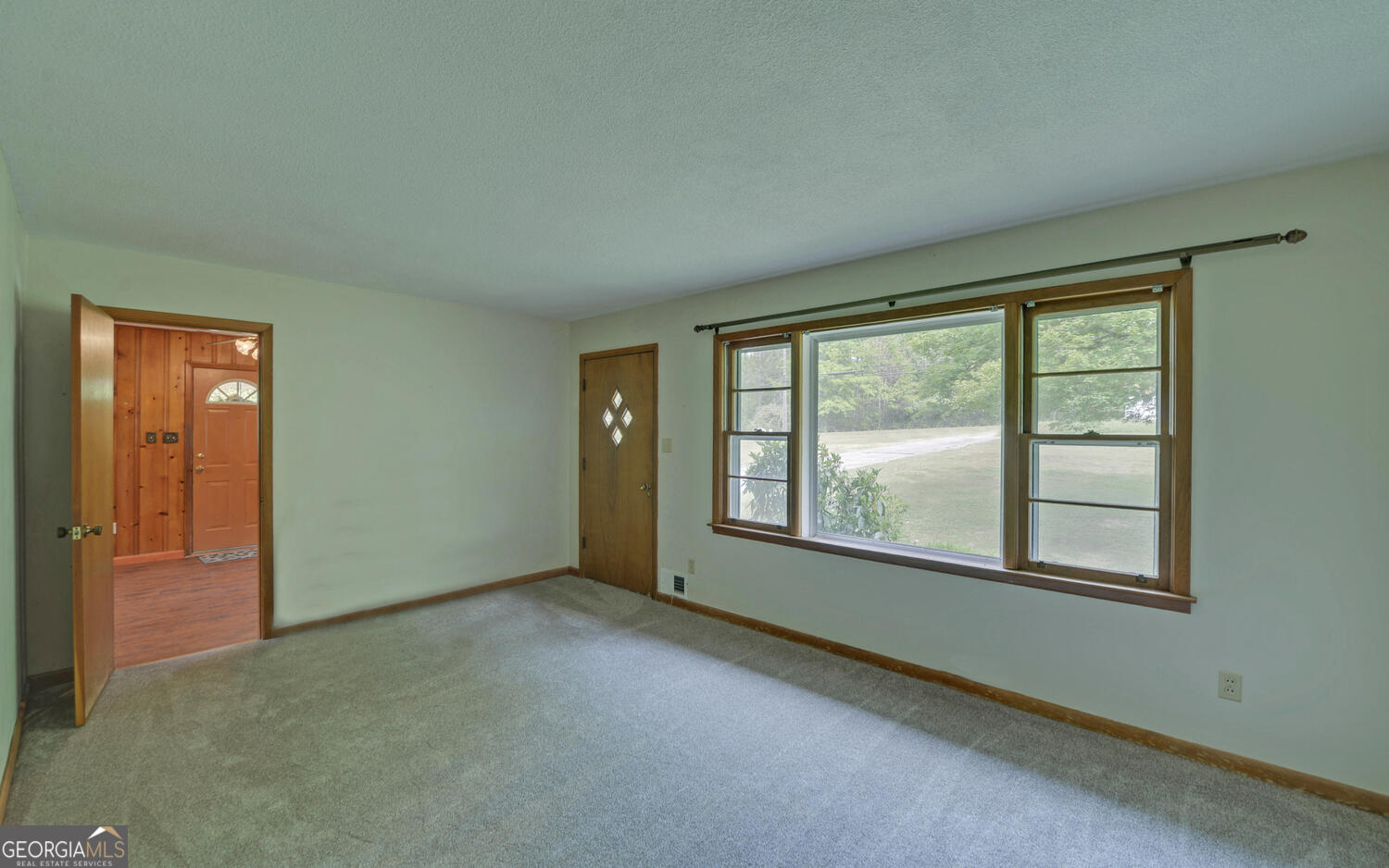 586 Collins Road Toccoa, GA 30577 - Photo 7 of 52 a view of an empty room with a window