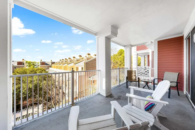 a kitchen with stainless steel appliances granite countertop a refrigerator a stove and a wooden floors