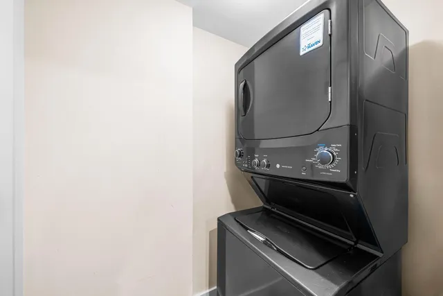 a view of a patio with couches table and chairs and potted plants