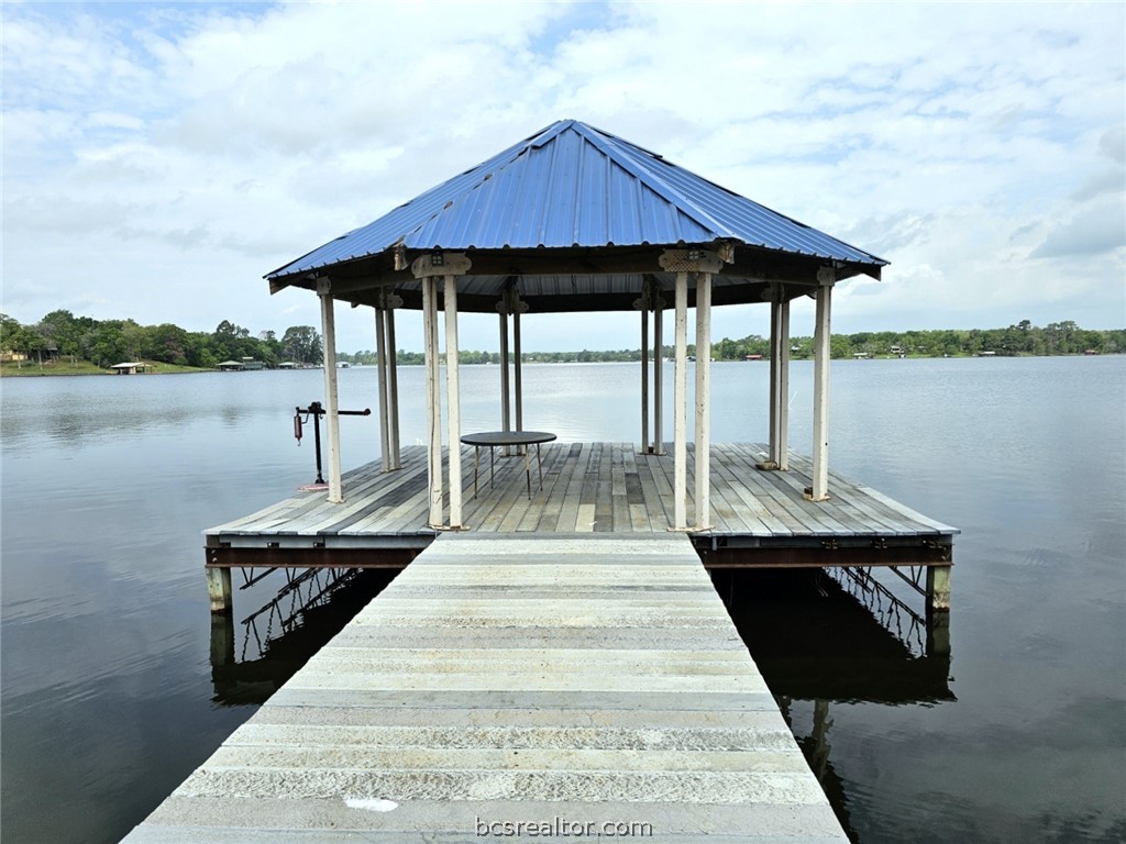 a view of a lake with sitting area