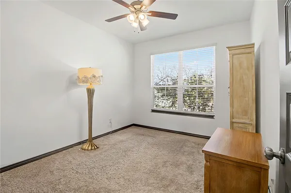 a bathroom with a granite countertop sink a toilet and bathtub