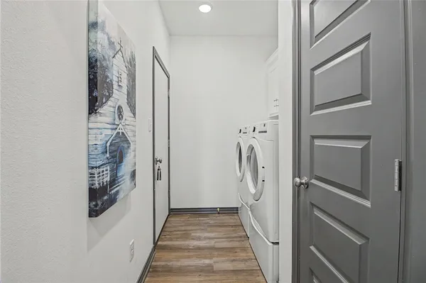 a view of a livingroom with wooden floor