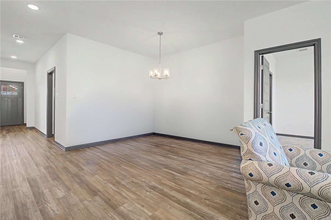 2406 Lightfoot Lane Bryan, TX 77803 - Photo 16 of 38 a view of a livingroom with wooden floor