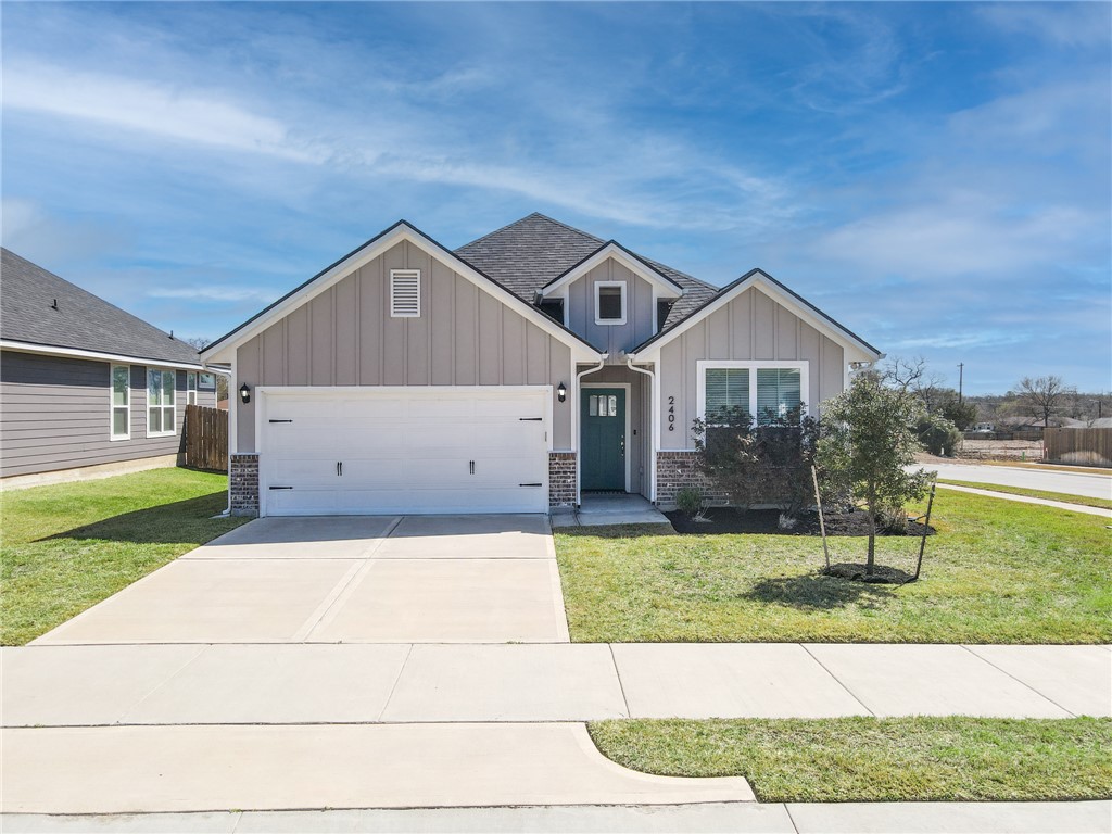 2406 Lightfoot Lane Bryan, TX 77803 - Photo 2 of 38 a front view of a house with a yard
