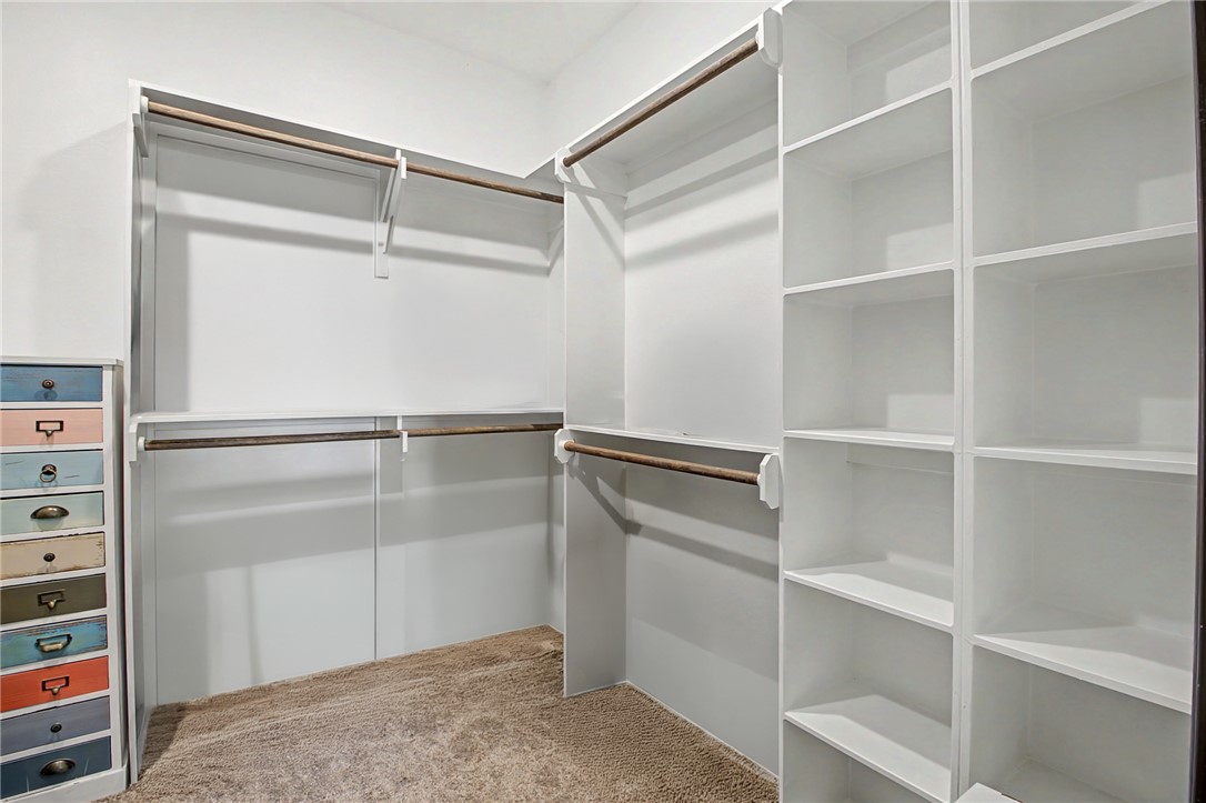 2406 Lightfoot Lane Bryan, TX 77803 - Photo 21 of 38 a view of walk in closet with empty racks