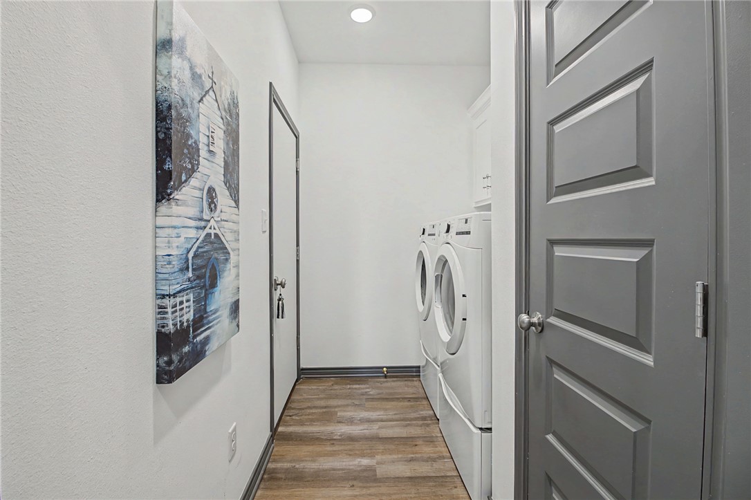 2406 Lightfoot Lane Bryan, TX 77803 - Photo 29 of 38 a view of a hallway with wooden floor and entryway
