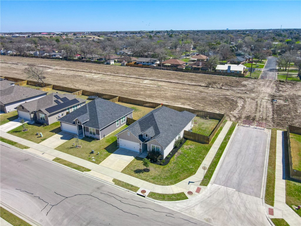 2406 Lightfoot Lane Bryan, TX 77803 - Photo 4 of 38 an aerial view of a house with a yard and lake view