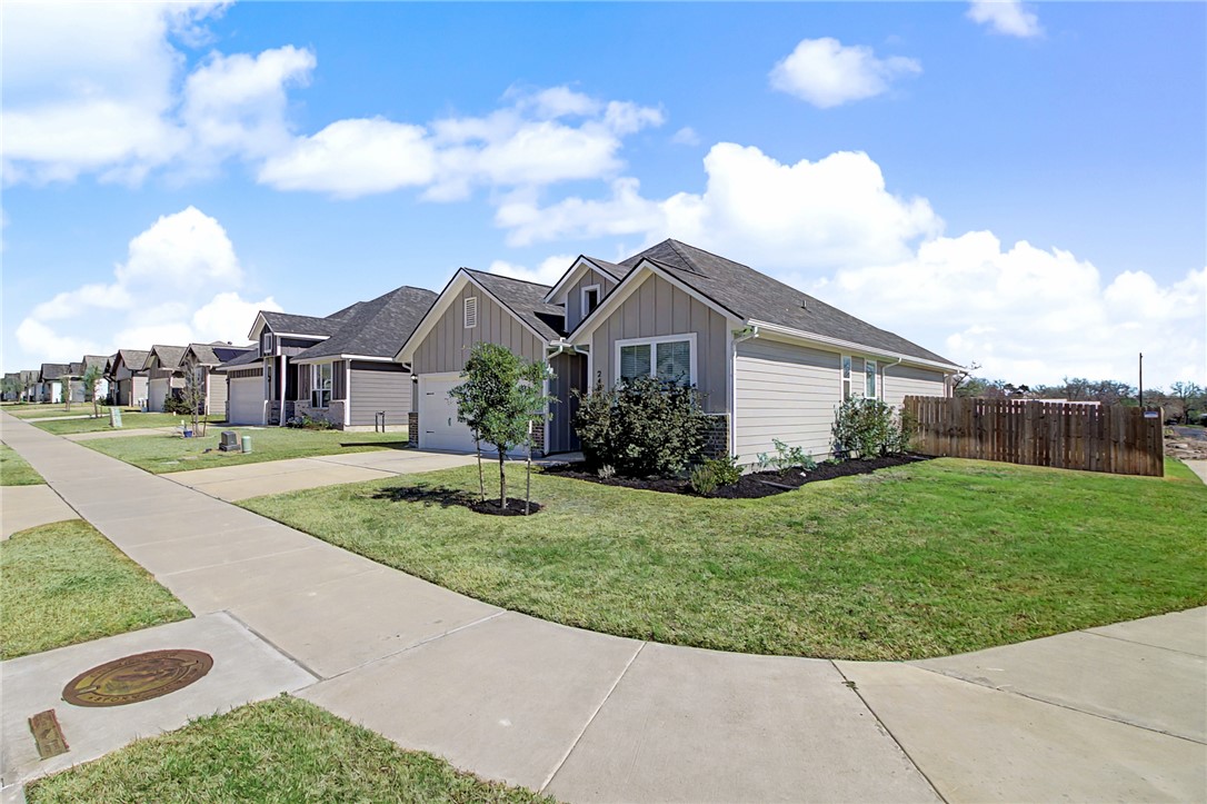 2406 Lightfoot Lane Bryan, TX 77803 - Photo 5 of 38 a front view of a house with garden