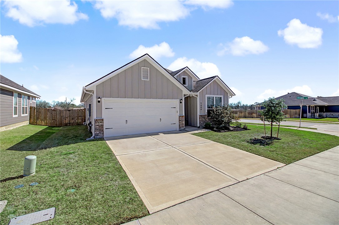 2406 Lightfoot Lane Bryan, TX 77803 - Photo 7 of 38 a house view with a garden space