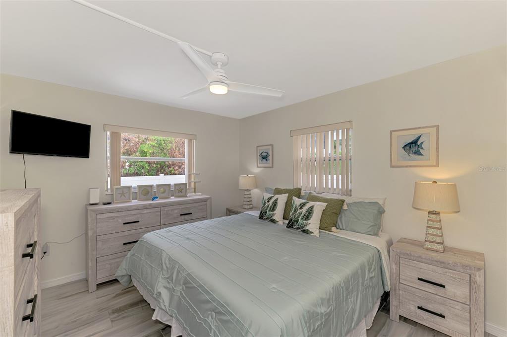 446 Canal Road, Unit 5 Sarasota, FL 34242 - Photo 14 of 64 a bedroom with a bed and a window