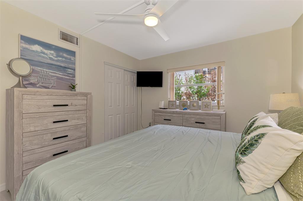446 Canal Road, Unit 5 Sarasota, FL 34242 - Photo 15 of 64 a bedroom with a bed and a window